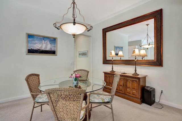 view of carpeted dining area