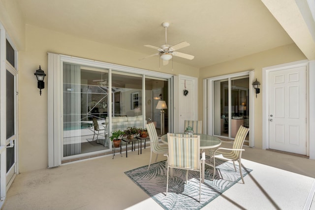 view of patio featuring ceiling fan