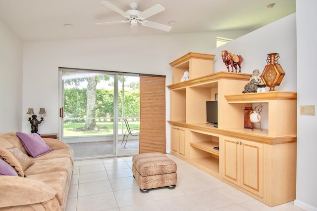 tiled living room with vaulted ceiling, built in shelves, and ceiling fan