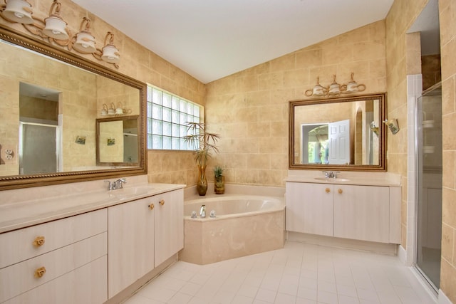 bathroom with vaulted ceiling, tile walls, and tile floors