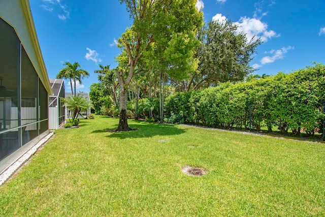 view of yard featuring a lanai