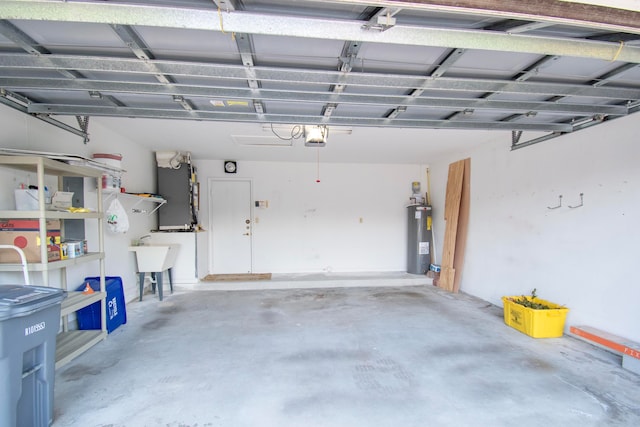 garage featuring sink, a garage door opener, and electric water heater