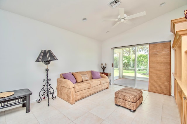 tiled living room featuring ceiling fan and lofted ceiling