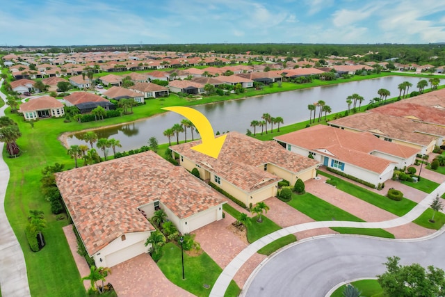 birds eye view of property with a water view