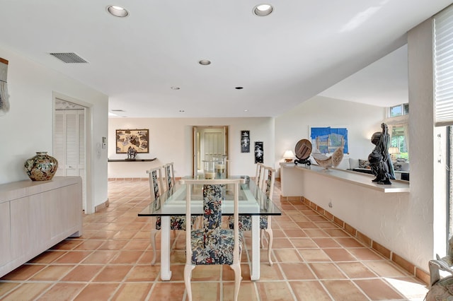 dining room with light tile patterned flooring