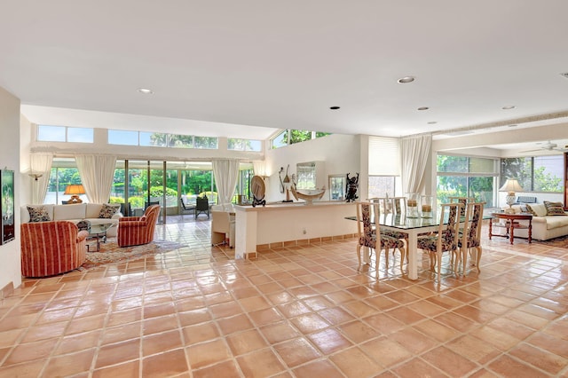 tiled dining space featuring plenty of natural light