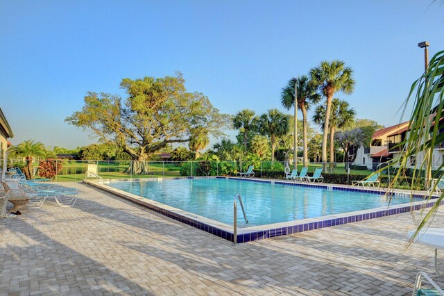 view of swimming pool featuring a patio area