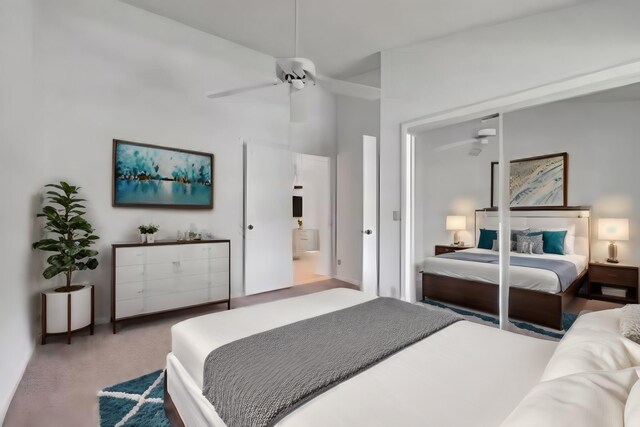 bedroom featuring high vaulted ceiling, a closet, carpet, and ceiling fan