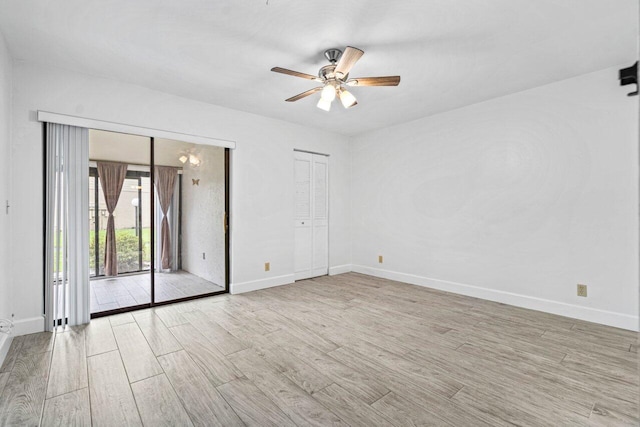 spare room with ceiling fan and light hardwood / wood-style floors