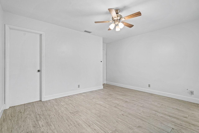 spare room with light hardwood / wood-style flooring and ceiling fan