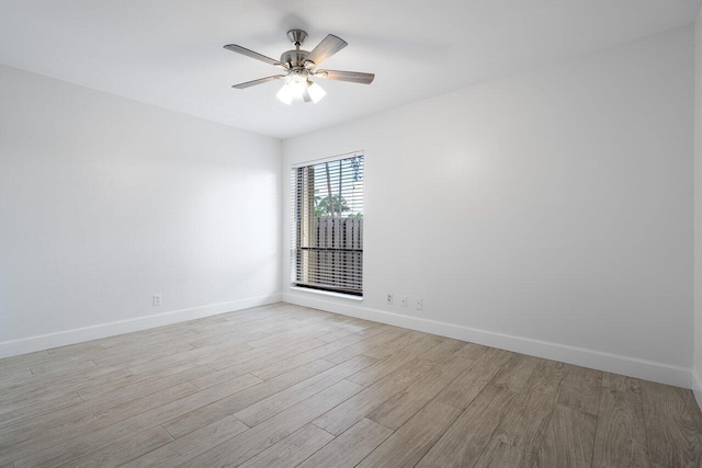 unfurnished room featuring ceiling fan and light wood-type flooring