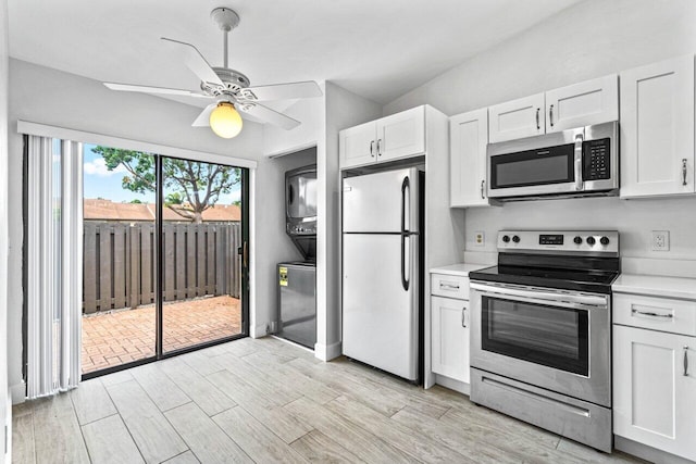 kitchen with white cabinetry, ceiling fan, light hardwood / wood-style floors, and appliances with stainless steel finishes