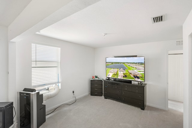 bedroom featuring light colored carpet