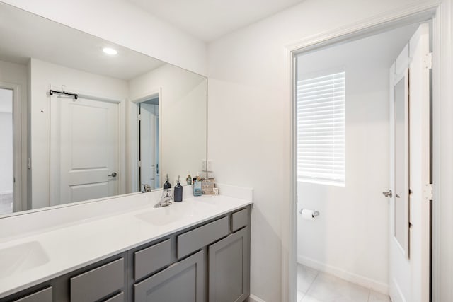 bathroom featuring tile patterned floors and vanity