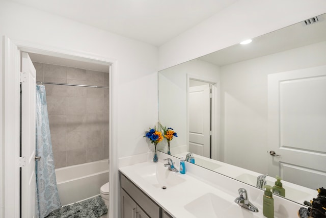 full bathroom with shower / bathtub combination with curtain, vanity, and toilet