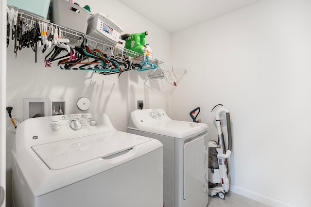 clothes washing area featuring independent washer and dryer