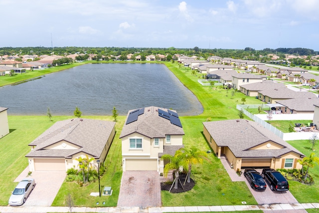 birds eye view of property with a water view