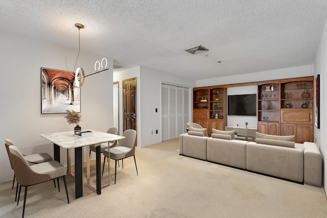 carpeted living room with a textured ceiling