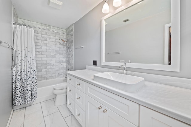 full bathroom featuring shower / bath combo, toilet, and vanity