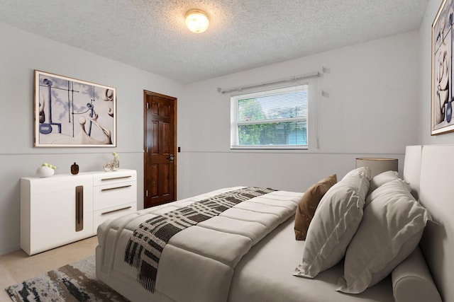 bedroom featuring a textured ceiling