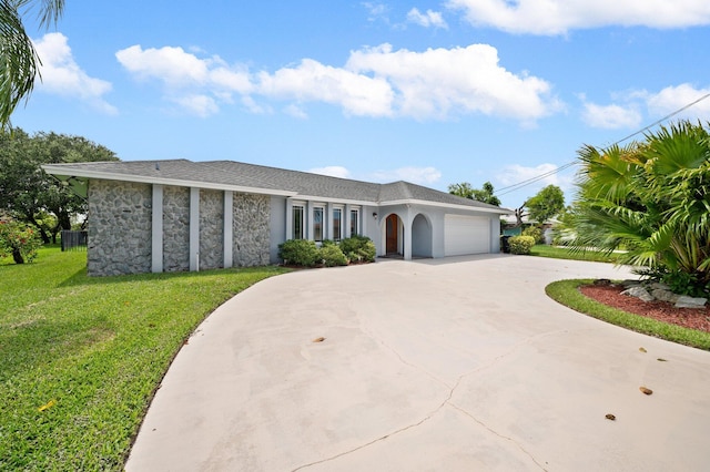 ranch-style home with a front lawn and a garage