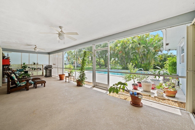 sunroom / solarium with ceiling fan