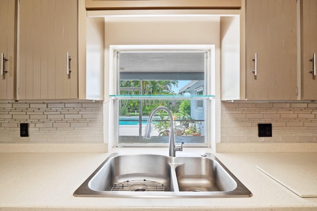 kitchen with backsplash and sink