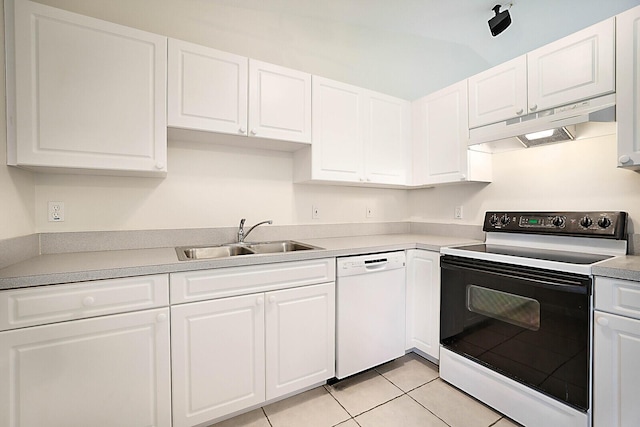 kitchen featuring white cabinets, electric range oven, white dishwasher, under cabinet range hood, and a sink