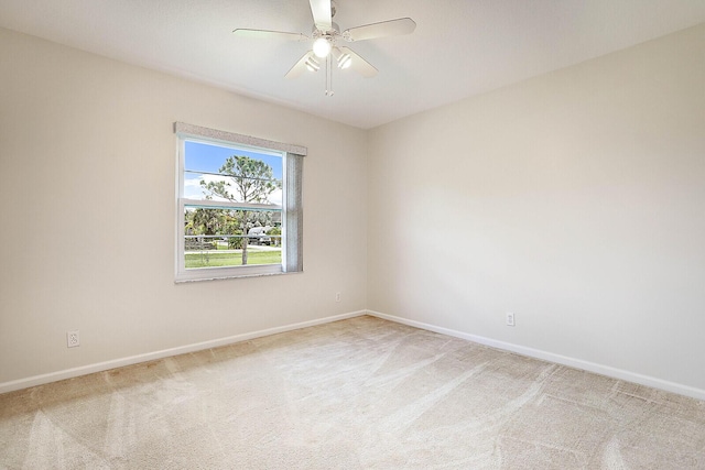 unfurnished room with ceiling fan, carpet, and baseboards