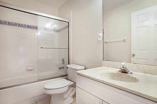 full bathroom with toilet, shower / bath combination with glass door, tile patterned floors, and vanity