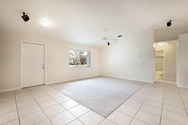 unfurnished room featuring light tile patterned floors and ceiling fan