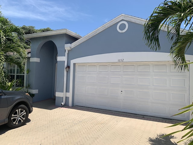 view of front of property with a garage