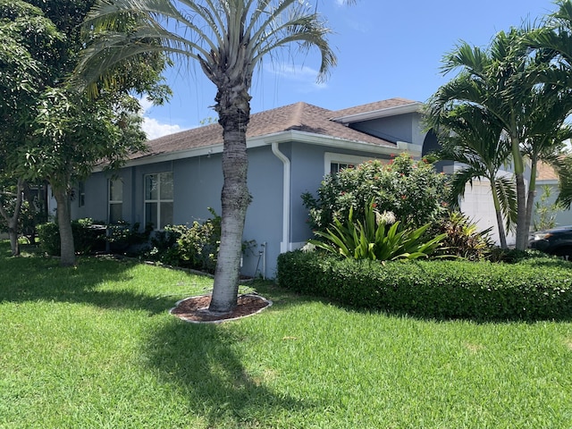 view of home's exterior with a yard