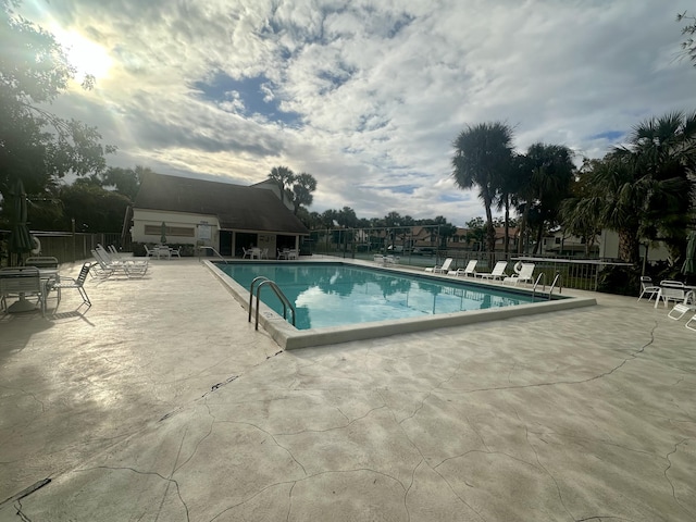 view of swimming pool featuring a patio