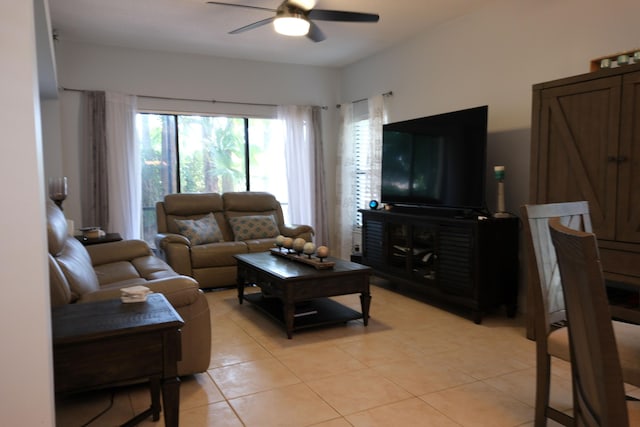 tiled living room with ceiling fan