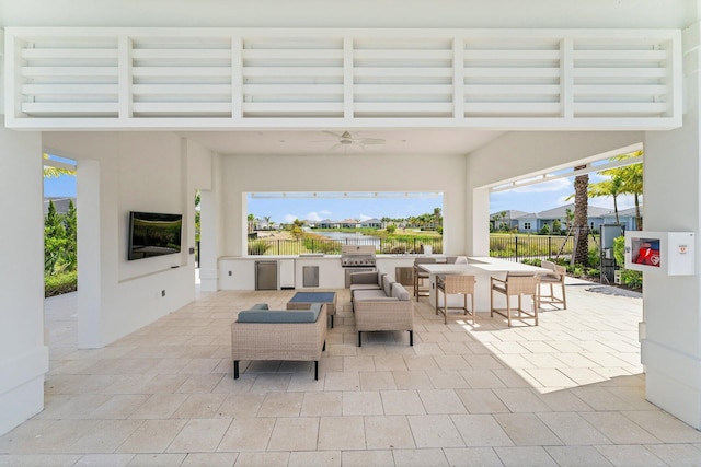 view of patio / terrace featuring exterior kitchen, an outdoor hangout area, ceiling fan, and grilling area