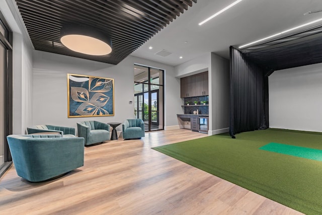 rec room featuring baseboards, visible vents, wood finished floors, golf simulator, and recessed lighting