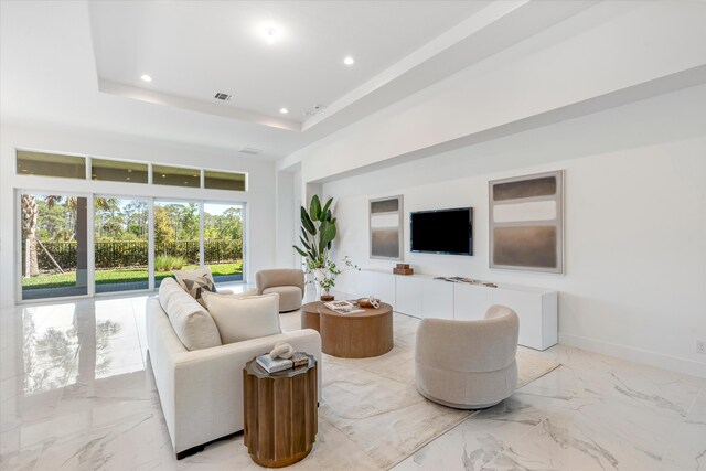 unfurnished room featuring light tile patterned flooring, an inviting chandelier, and a wealth of natural light