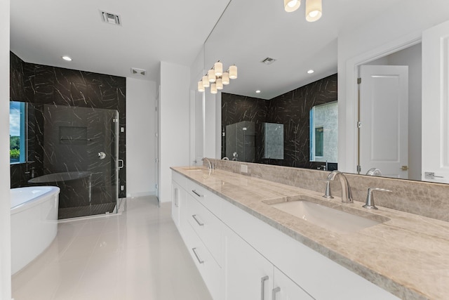 bathroom featuring tile patterned floors, separate shower and tub, and double sink vanity