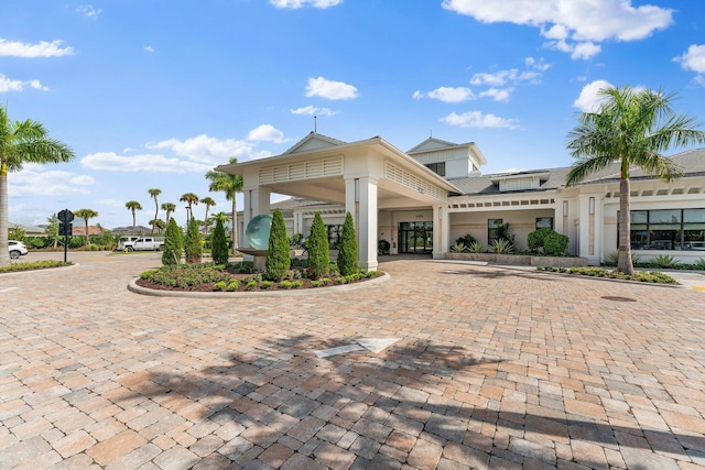 view of property featuring decorative driveway