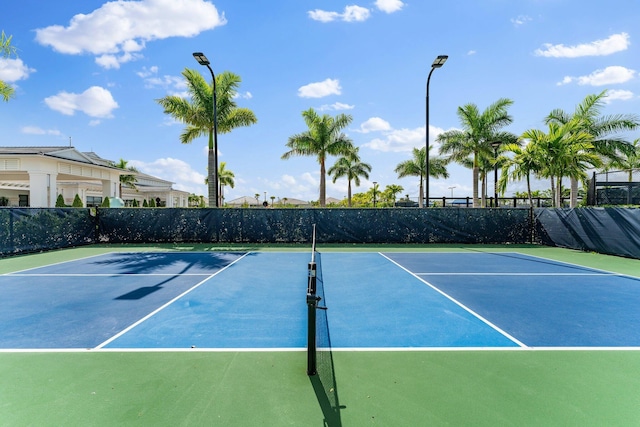 view of sport court with fence