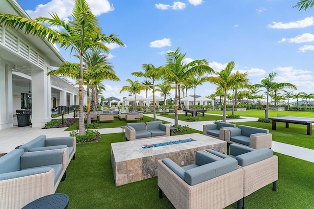 view of home's community with a patio and a yard