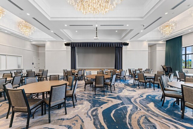 dining space with light hardwood / wood-style floors, an inviting chandelier, french doors, and a towering ceiling