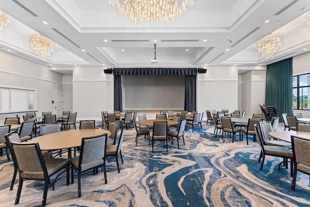 dining area with an inviting chandelier and a tray ceiling