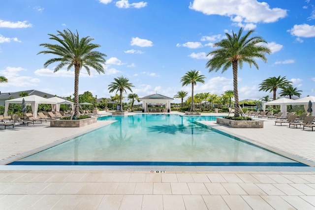 view of swimming pool with a patio and a gazebo