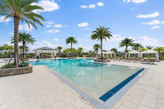 pool featuring a gazebo and a patio area