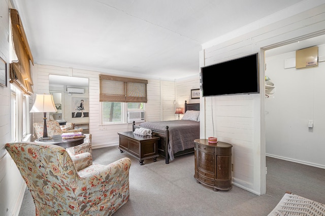 living room with a wall unit AC, carpet, and wood walls