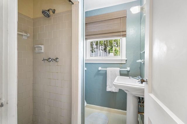 bathroom with tiled shower