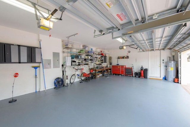 garage with a garage door opener, water heater, and electric panel