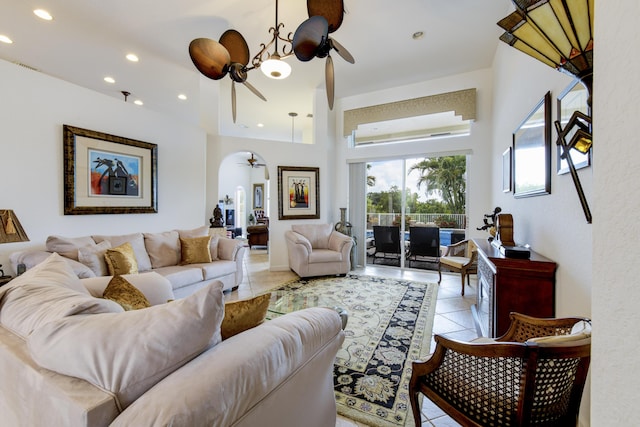 tiled living room with ceiling fan